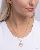 Emblematic Elegance - Gold - V  - Paparazzi Accessories Hexagon Initial Necklace PREORDER